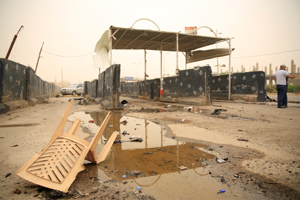 A damaged checkpoint is seen after an attack staged with bomb-laden vehicle in Abu Dsheer neighborhood of Baghdad, Iraq on May 20, 2017. Murtadha Sudani - AA
