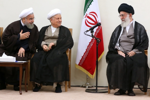 File photo of Iran's supreme leader Ayatollah Ali Khamenei, right, speaking with President Hassan Rouhani, left, and former president Akbar Hashemi Rafsanjani, centre, during an Assembly of Experts meeting (AFP) 