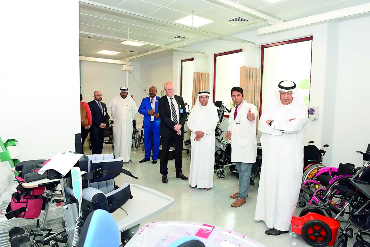 Officials demonstrate power chairs and other mobility devices to guests.