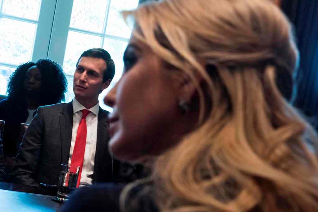 (FILES) This file photo taken on March 17, 2017 shows White House Senior Advisor Jared Kushner (L) and wife Ivanka Trump before a meeting with business leaders in the Cabinet Room of the White House in Washington, DC. AFP / Brendan Smialowski