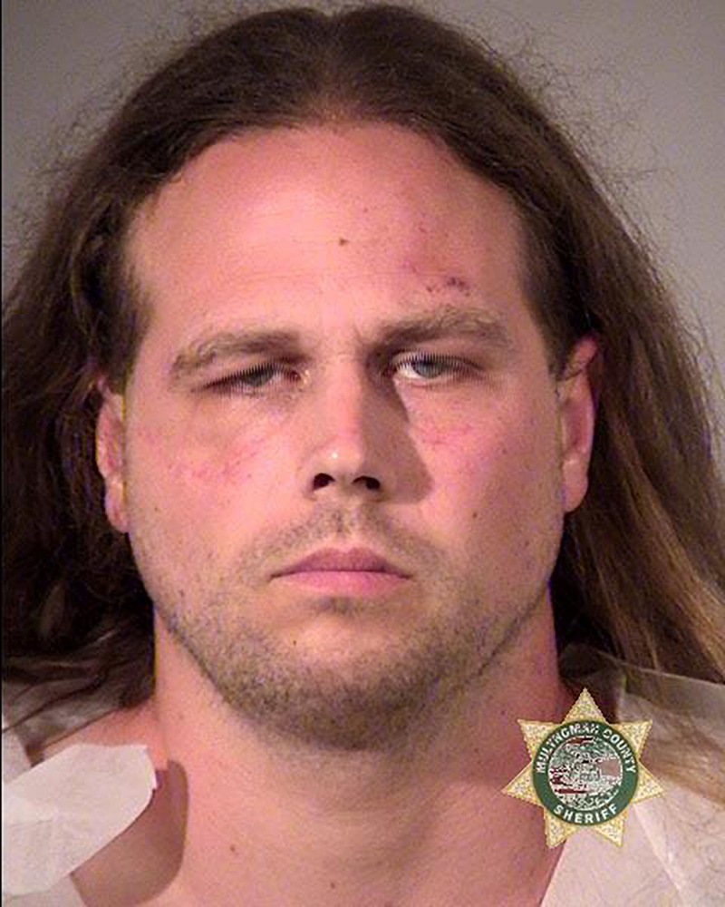 This police booking photo obtained May 27, 2017 courtesy of the Portland Police shows suspect Jeremy Joseph Christian, who allegedly stabbed to death two men on a train May 26, 2017 in Portland, Oregon when they tried to help two young women who were bein