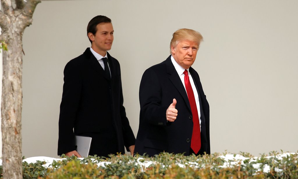 FILE PHOTO: US President Donald Trump gives a thumbs-up as he and White House Senior Advisor Jared Kushner depart the White House in Washington, US, March 15, 2017. REUTERS/Kevin Lamarque/File Photo