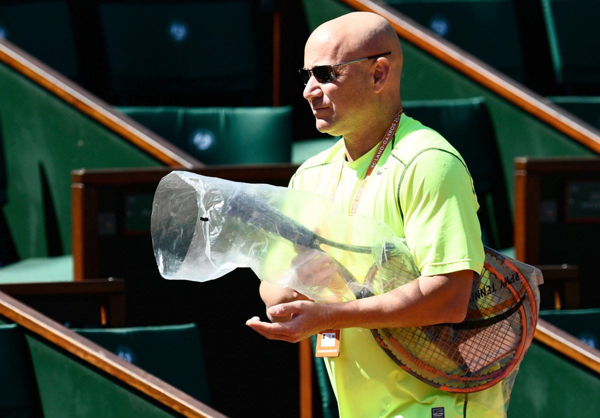 US coach Andre Agassi arrives for a training session ahead of the Roland Garros 2017 French Tennis Open on May 26, 2017 in Paris. Andre Agassi will coach Serbia's player Novak Djokovic during the French Open. (AFP / CHRISTOPHE SIMON)