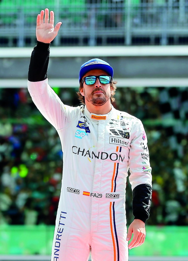 Fernando Alonso of Spain, driver of the McLaren-Honda-Andretti Honda, waves during driver introductions ahead of the 101st running of the Indianapolis 500 at Indianapolis Motorspeedway in Indianapolis, Indiana on Sunday.
