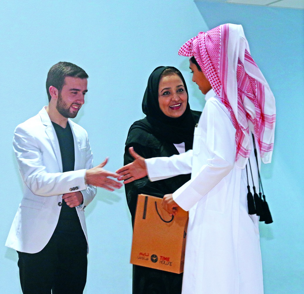 A winner of the Holy Quran memorisation contest receiving his prize. 