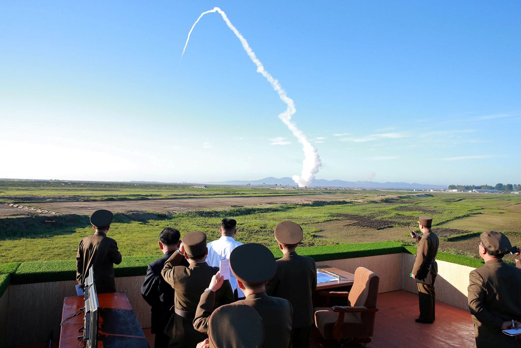 FILE PHOTO: North Korean leader Kim Jong Un watches the test of a new-type anti-aircraft guided weapon system organised by the Academy of National Defence Science in this undated photo released by North Korea's Korean Central News Agency (KCNA) May 28, 20