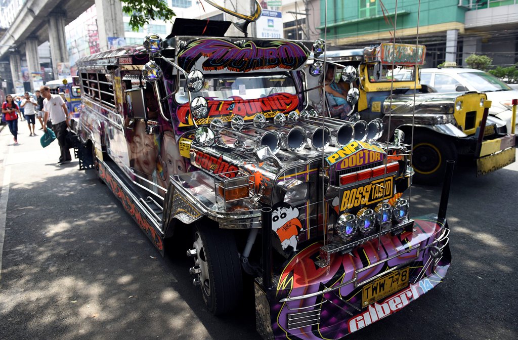 A jeepney adorned with colorful pop culture characters is photographed on a main thoroughfare in Quezon City, metro Manila, Philippines May 29, 2017. REUTERS/Dondi Tawatao 