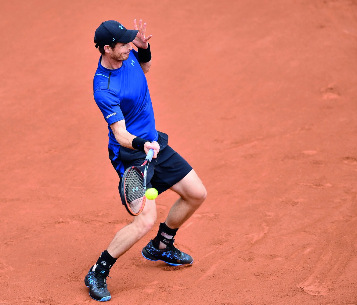 Andy Murray of Great Britain returns to Andrey Kuznetsov of Russia in their first round match of the French Open at the Roland Garros Stadium in Paris, France yesterday. Murray won 6-4, 4-6, 6-2, 6-0.