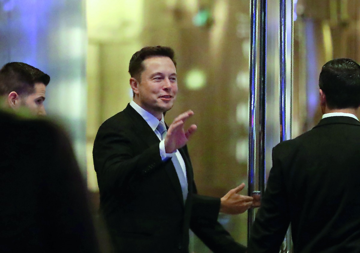Elon Musk, the co-founder and CEO of Electric carmaker Tesla, during a ceremony in Dubai. Tesla founder and technology luminary Elon Musk has said that he would quit President Donald Trump's business advisory council if Washington pulls out of the Paris c