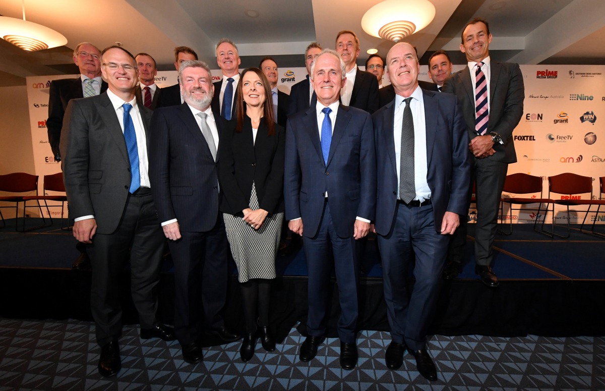 Australian Prime Minister Malcolm Turnbull (front row, 2nd R) and media bosses pose for a picture at an event on media ownership laws at Parliament House in Canberra, Australia May 31, 2017. AAP/Mick Tsikas/via REUTERS