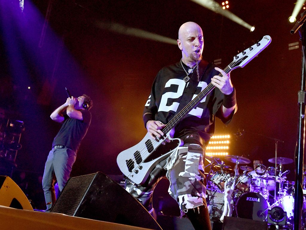 (FILES) This file photo taken on April 05, 2015 shows singer Serj Tankian (L) and musician Shavo Odadjian of System of a Down performing at The Forum in Inglewood, California.  AFP 