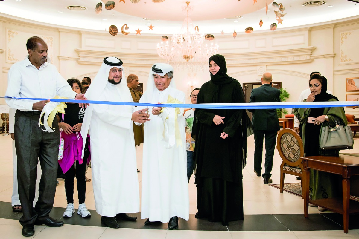 Officials cutting the ribbon at the opening of 'Layali Al Khair' at Qafco’s Al-Banush Club in Mesaieed. 