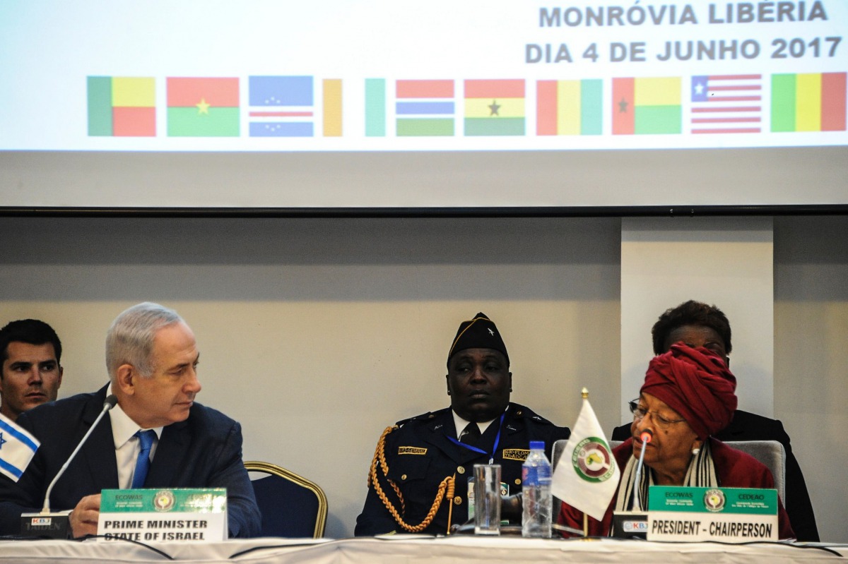 Israel's Prime Minister Benjamin Netanyahu (2-L) looks on as Liberia's President and ECOWAS (Economic Community of West African States) Chairperson Ellen Johnson Sirleaf (R) speaks during the ECOWAS summit on June 4, 2017 in Monrovia. AFP / Zoom DOSSO