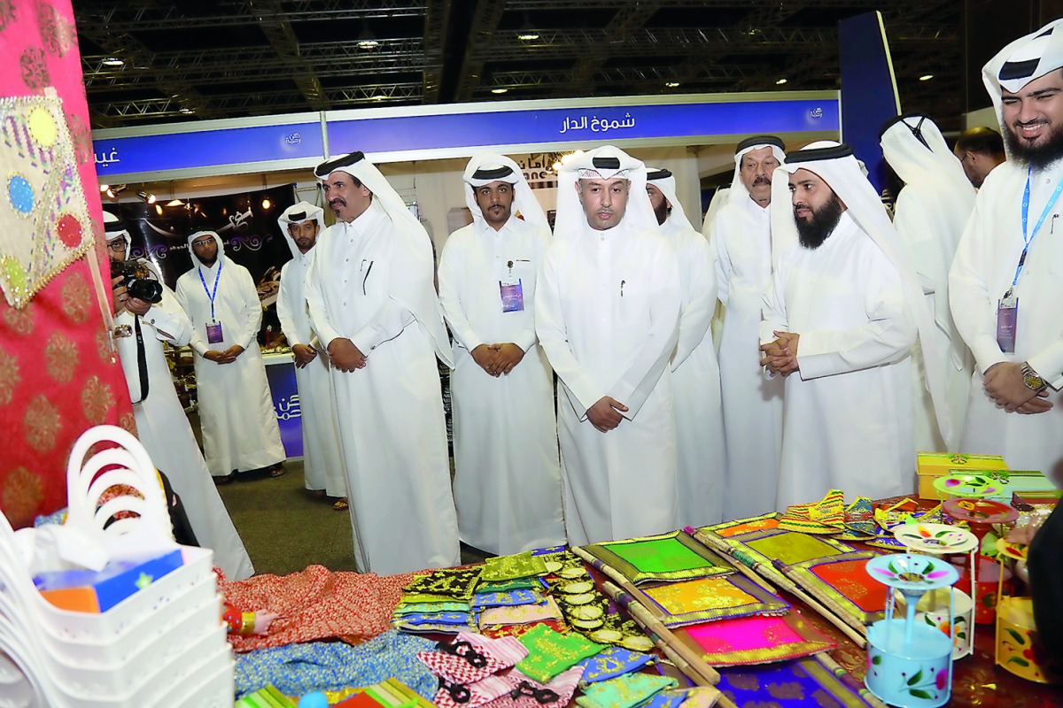 Minister of Administrative Development, Labour and Social Affairs H E Dr Issa bin Saad Al Jafali Al Nuaimi after inaugurating a charity bazaar at QNCC.