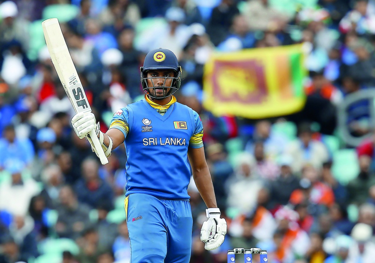 Sri Lanka's Danushka Gunathilaka acknowledges the crowd after reaching 50 runs during the ICC Champions Trophy match against India at the Oval in London on Thursday.