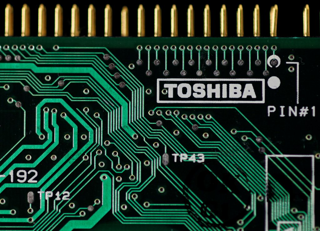 A logo of Toshiba Corp is seen on a printed circuit board in this photo illustration taken in Tokyo July 31, 2012. REUTERS/Yuriko Nakao/File Photo