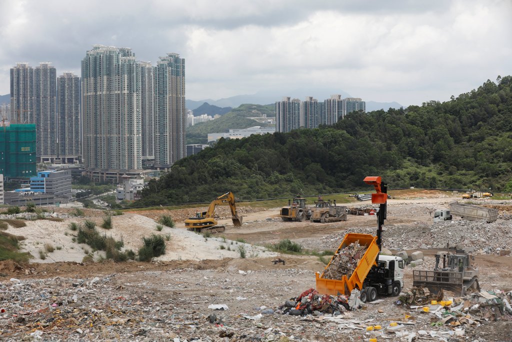 A truck unloads garbage at a landfill at Tseung Kwan O district in Hong Kong, China June 9, 2017. REUTERS/Tyrone Siu