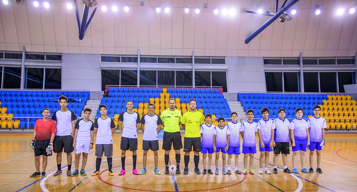 Teams taking part in the junior futsal tournament of the Ramadan Sports Festival (RSF) pose for a group picture before their match.
