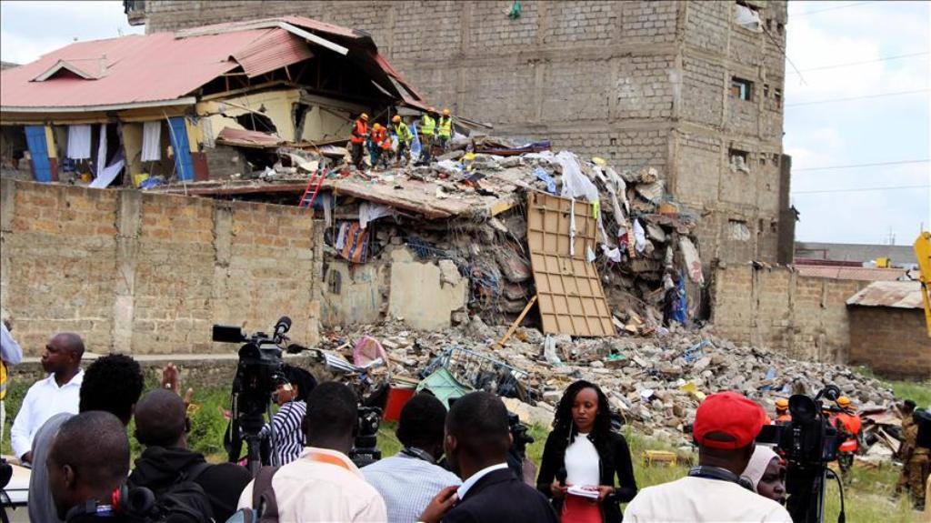 Rescue workers search debris after a seven-storey building collapsed in a residential area in Nairobi, Kenya on June 13, 2017. ( Andrew Wasike - Anadolu Agency ).