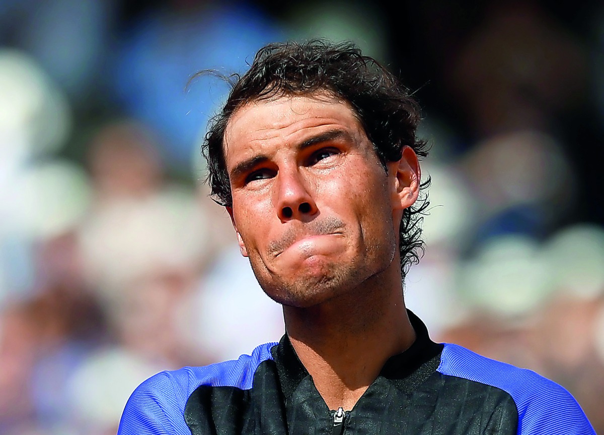 Spain's Rafael Nadal reacts after winning the French Open final - his 10th title - against Switzerland's Stan Wawrinka in Paris on Sunday.