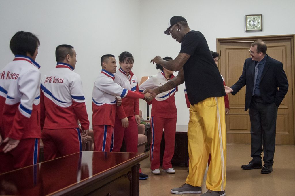Former NBA star Dennis Rodman (R) of the US greets North Korean athletes at the Pyongyang Indoor Stadium on June 15, 2017 Rodman arrived in the North Korean capital on June 13 on a mission he said he believed the US President would be 