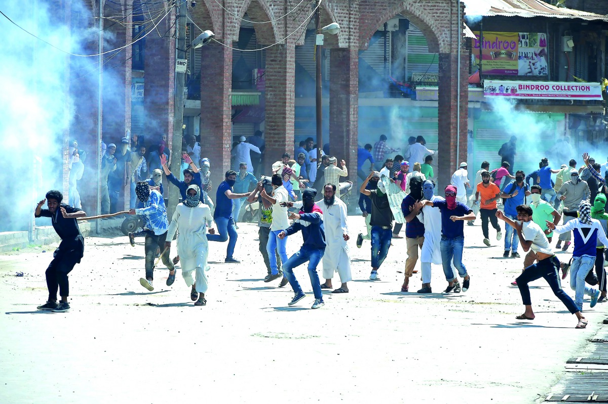 Protesters clash with Indian government forces in downtown Srinagar, yesterday. 