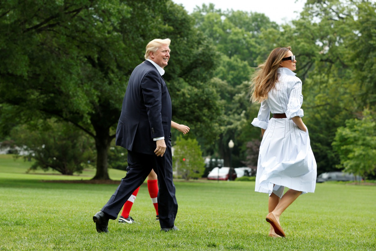 US President Donald Trump with first lady Melania and their son Barron walk on the South Lawn of the White House in Washington, U.S., before their departure to Camp David, June 17, 2017. (REUTERS/Yuri Gripas)