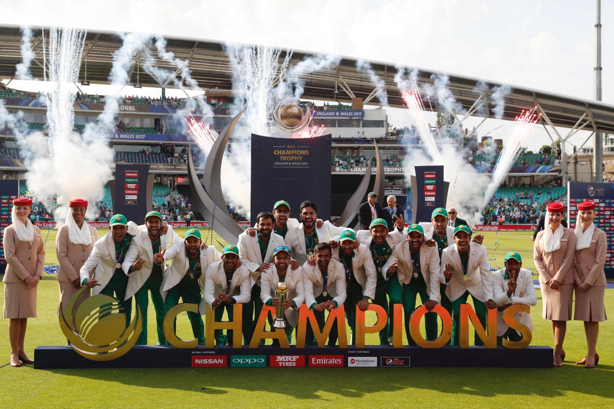 Pakistan players pose with the trophy as they celebrate their win at the presentation after the ICC Champions Trophy final cricket match between India and Pakistan at The Oval in London on June 18, 2017. Pakistan thrashed title-holders India by 180 runs t