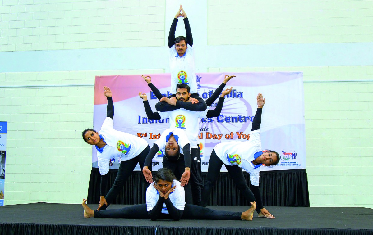 Participants demonstrating different yoga postures.