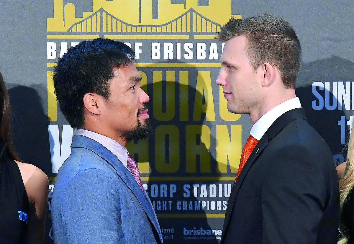 Boxers Manny Pacquiao (left) of the Philippines and Australia's Jeff Horn stand together following their official news conference ahead of their WBO welterweight fight in Brisbane, Australia yesterday. 
