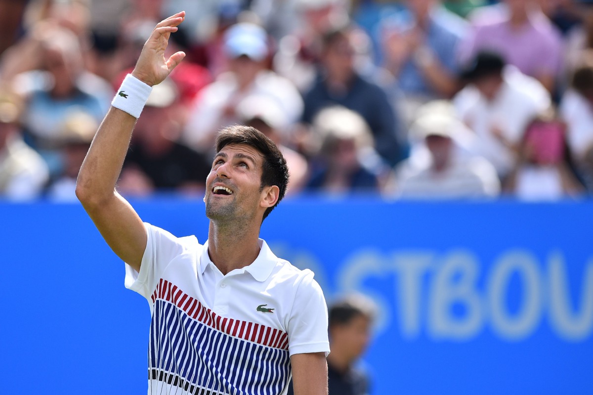 Serbia's Novak Djokovic celebrates victory over France's Gael Monfils during the men's final tennis match at the ATP Aegon International tennis tournament in Eastbourne, southern England, on July 1, 2017. Serbia's Novak Djokovic beat France's Gael Monfils