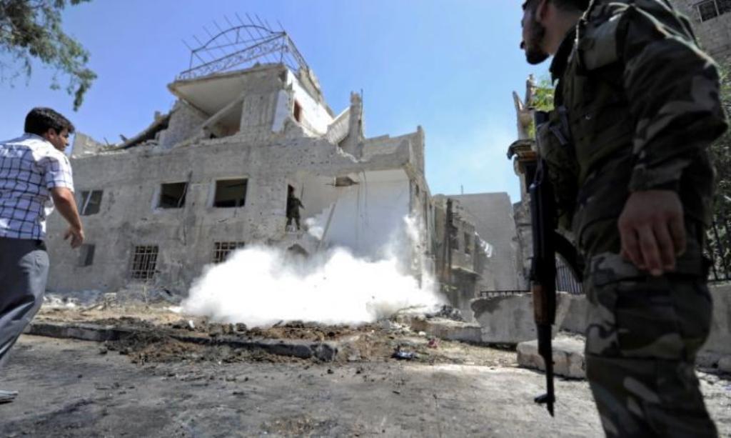 An army soldier secures the area of a blast site in the Baytara traffic circle near the Old City of Damascus, Syria July 2, 2017. REUTERS/Omar Sanadiki.