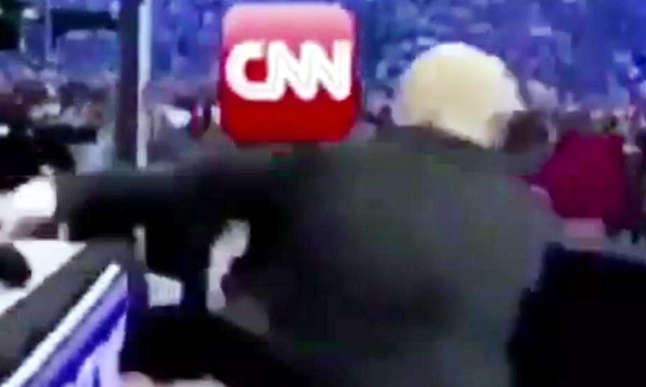After Trump appears to beat on the CNN effigy, a logo, “FNN Fraud News Network” appears at the bottom of the screen in script similar to that of CNN.