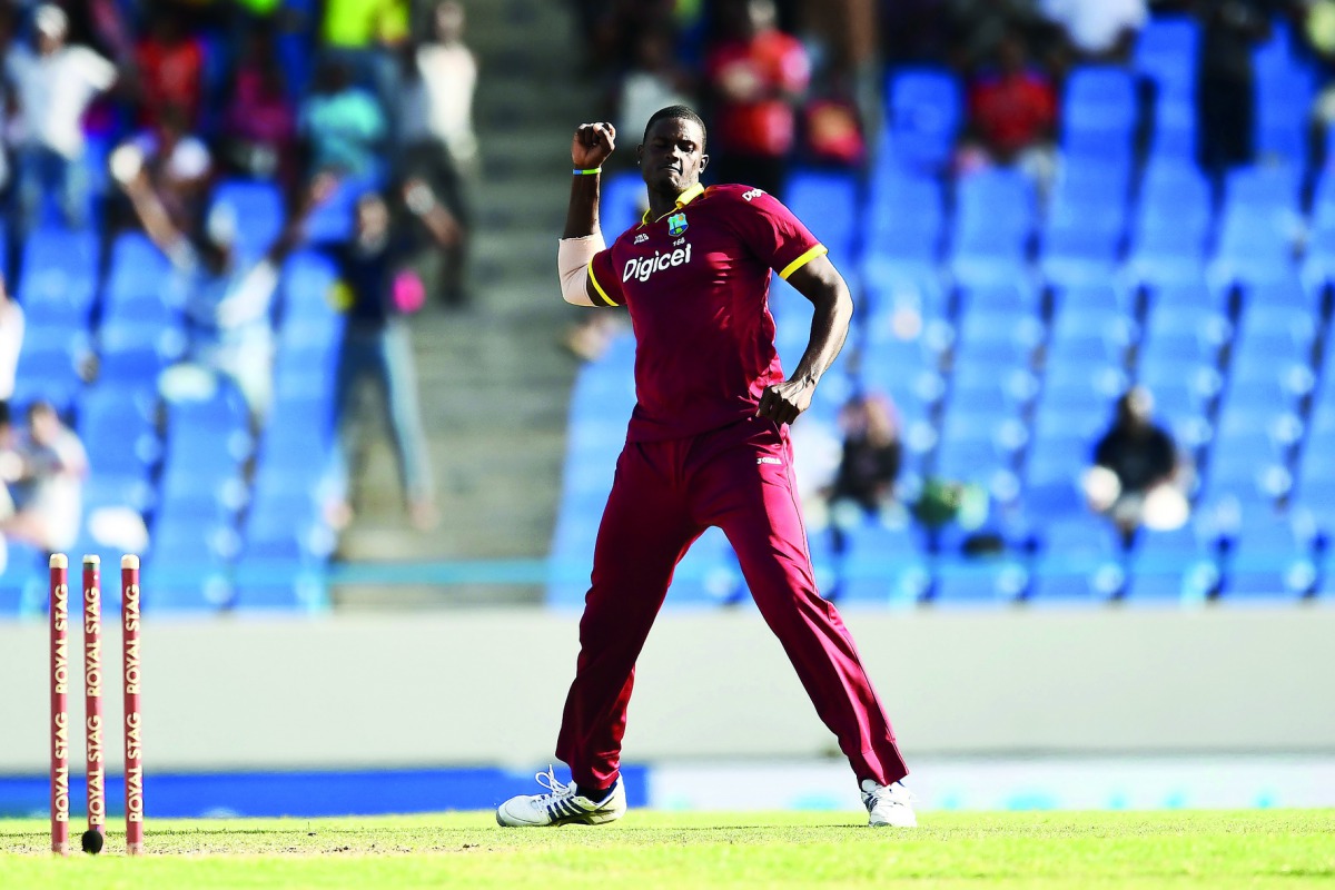 West Indies' captain Jason Holder celebrates after bowling out India's Hardik Pandya during their fourth One Day International (ODI) at the Sir Vivian Richards Cricket Ground in St. John's, Antigua, on Sunday.