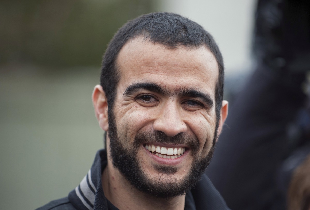 Omar Khadr smiles as he answers questions during a news conference after being released on bail in Edmonton, Alberta, May 7, 2015. Khadr, a Canadian, was once the youngest prisoner held on terror charges at Guantanamo Bay. REUTERS/Dan Riedlhuber