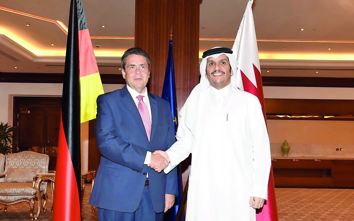 Foreign Minister H E Sheikh Mohammed bin Abdulrahman Al Thani with his German counterpart  Sigmar Gabriel, in Doha, yesterday.