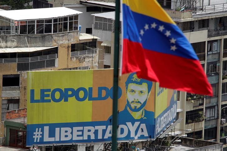 A billboard depicting jailed Venezuelan opposition leader Leopoldo Lopez is seen during a rally against Venezuela's President Nicolas Maduro in Caracas, Venezuela, May 26, 2017. (REUTERS/Christian Veron)