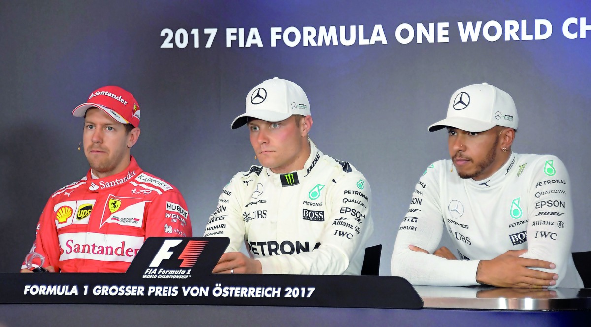 FROM LEFT: Ferrari's Sebastian Vettel, Mercedes' Valtteri Bottas and Mercedes' Lewis Hamilton attend a drivers' press conference after the qualifying session of the Formula One Austrian Grand Prix at the Red Bull Ring in Spielberg