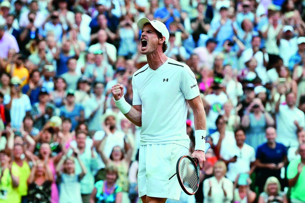 Britain's Andy Murray celebrates beating Italy's Fabio Fognini during their men's singles third round match on the fifth day of the 2017 Wimbledon Championships at The All England Lawn Tennis Club in Wimbledon, southwest London, on Friday.