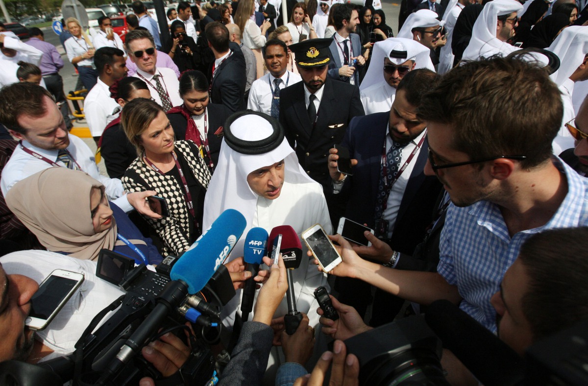 Qatar Airways Chief Executive Akbar al-Baker speaks to reporters after unveiling a commemorative signing wall in support of Qatar’s Emir Sheikh Tamim Bin Hamad Al-Thani in Doha, Qata, July 13, 2017. (REUTERS/Naseem Zeitoon)
