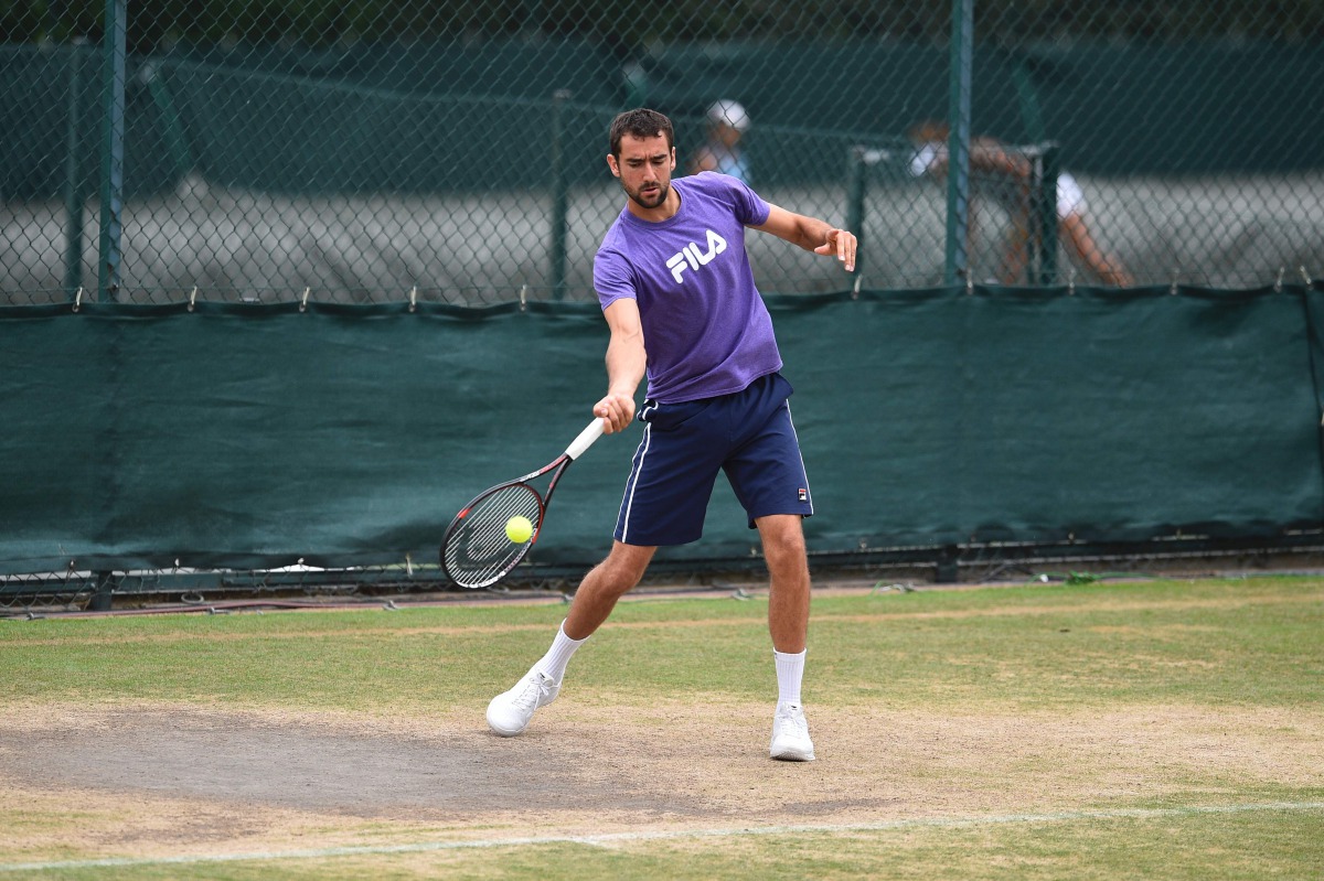 Croatia's Marin Cilic hits a shot as he attends a practice session at The All England Lawn Tennis Club in Wimbledon, southwest London, on July 13, 2017 on the tenth day of the 2017 Wimbledon Championships, on the eve of his semi-final match against US pla