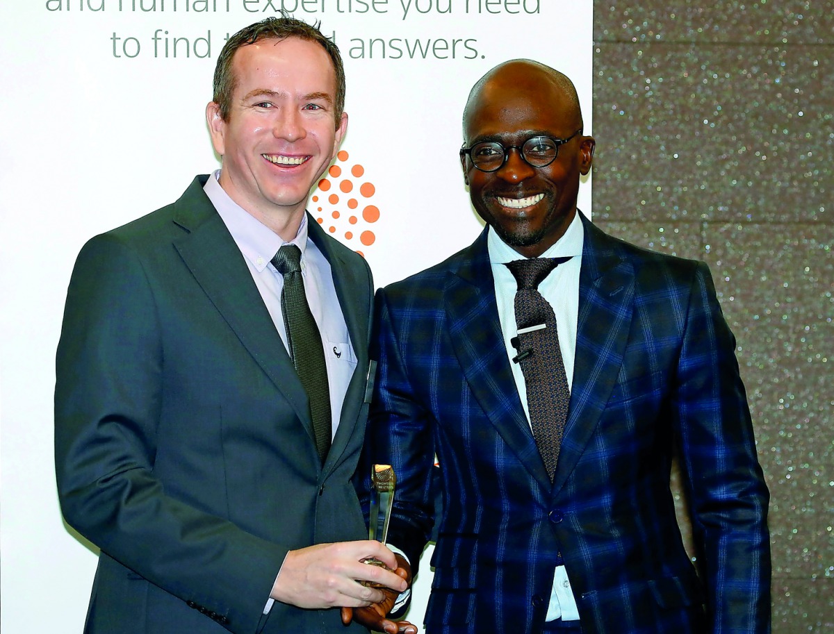 South Africa's finance minister, Malusi Gigaba (right), poses with Johannes Jordaan, an independent economist at Economic Modelling Solutions after he was named the Thomson Reuters economist of the year in Sandton, yesterday.