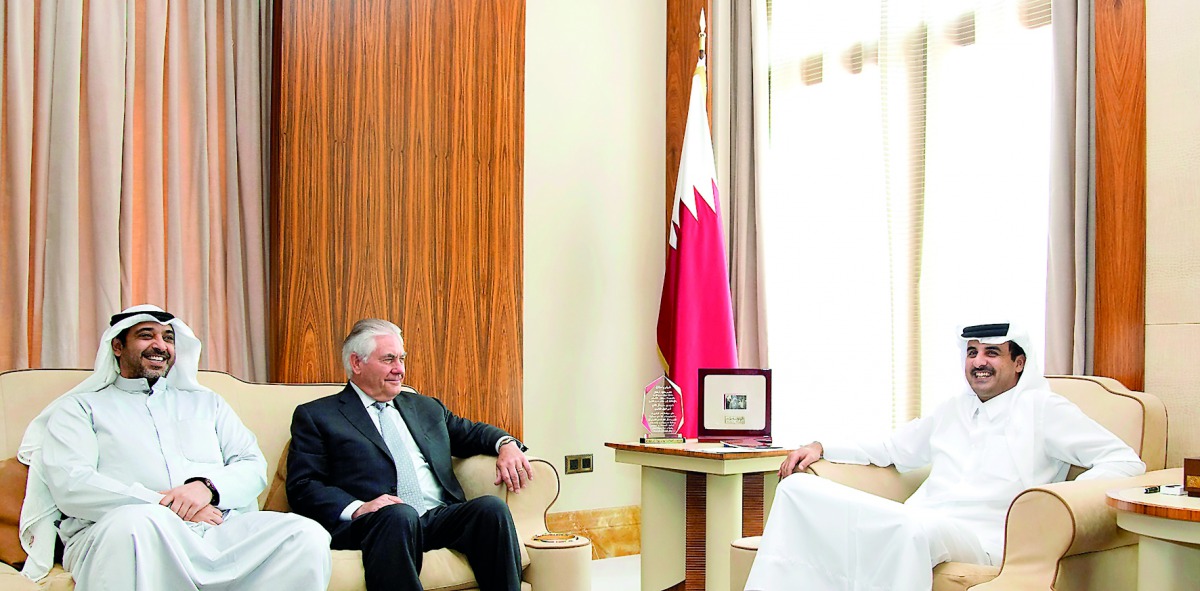 Emir H H Sheikh Tamim bin Hamad Al Thani with the US Secretary of State, Rex Tillerson, and Kuwait's Minister of State for Cabinet Affairs and Acting Minister of Information, H E Sheikh Mohammed Al Abdullah Al Mubarak Al Sabah, at Al Bahr Palace, yesterda
