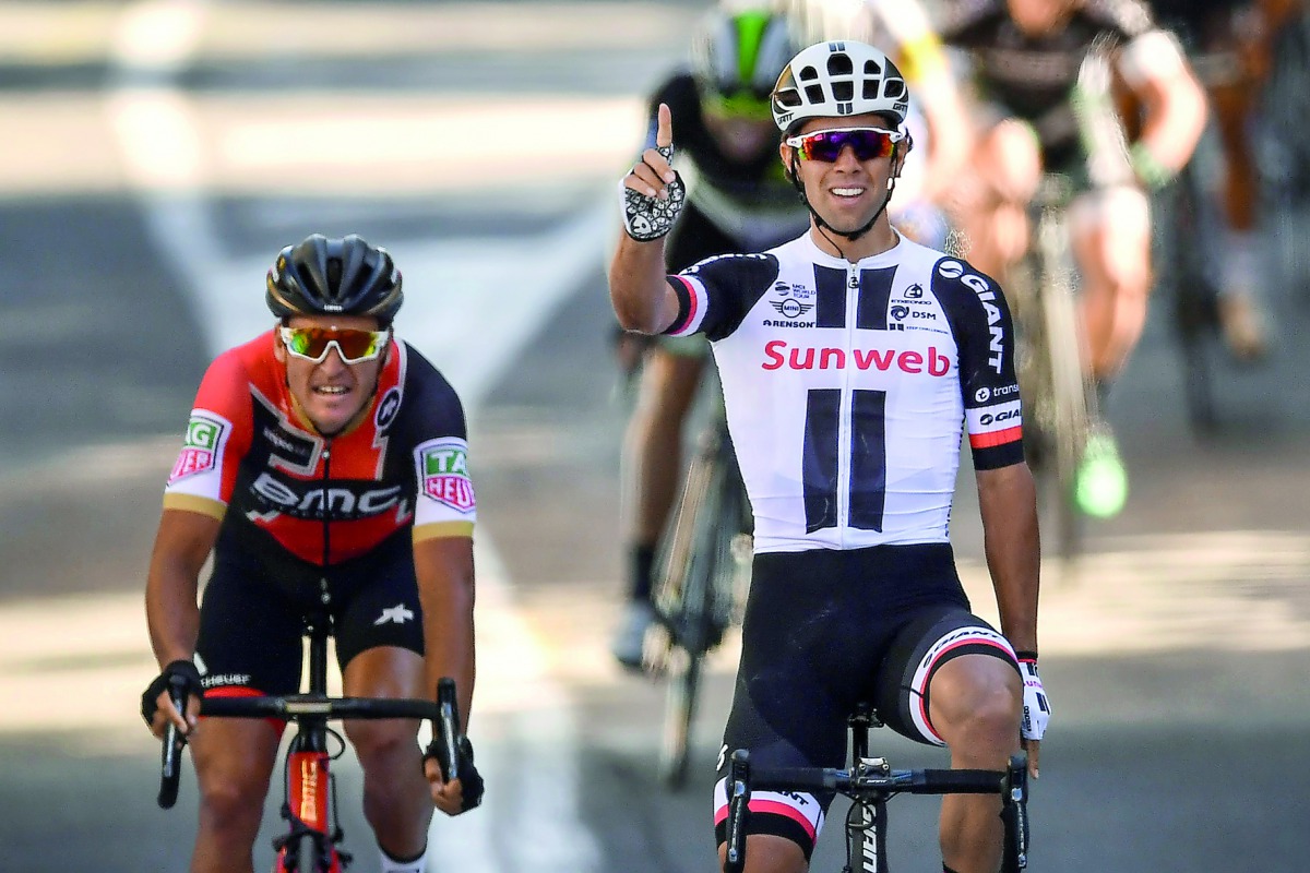 Australia's Michael Matthews celebrates as he crosses the finish line ahead of Belgium's Greg Van Avermaet at the end of the 181,5 km fourteenth stage of the 104th edition of the Tour de France cycling race yesterday between Blagnac and Rodez.