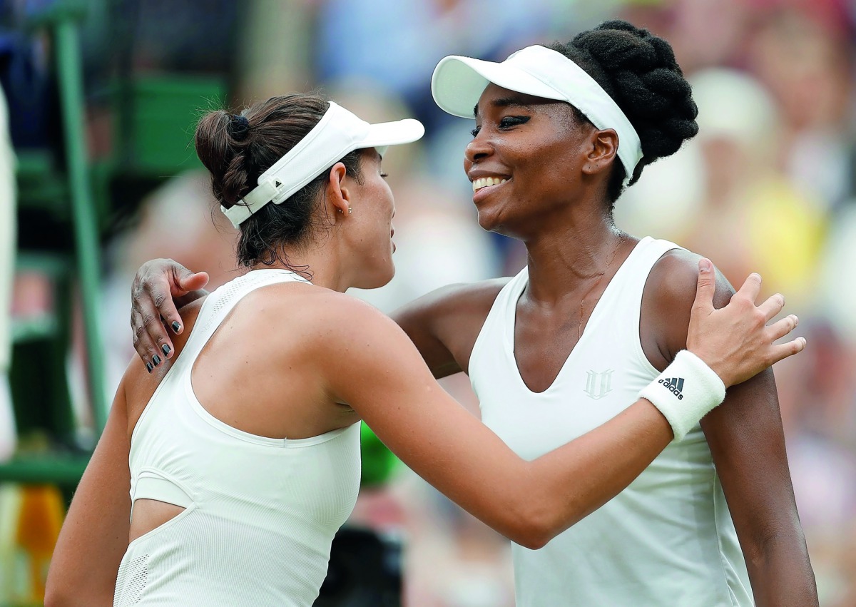 Spain’s Garbine won Wimbledon final against Venus Williams of the US at The All England Lawn Tennis Club in Wimbledon, southwest London yesterday. Muguruza won 7-5, 6-0. Here, Muguruza is congratulated by Venus Williams.