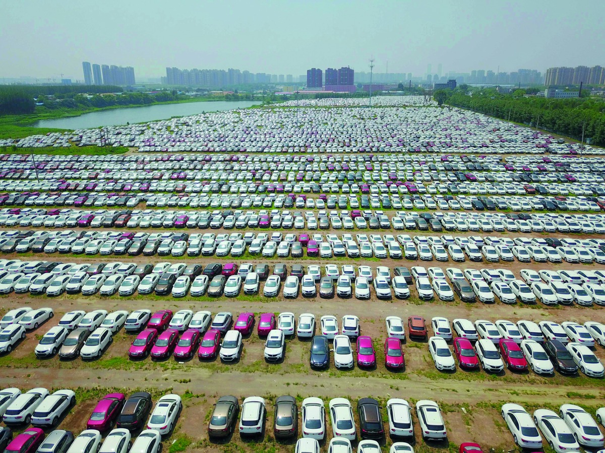 New cars in a parking lot of the Brilliance factory in Shenyang, in China’s northeast Liaoning province, yesterday. China posted better-than-expected growth in the second quarter, official data showed, but authorities warned that the world’s second larges