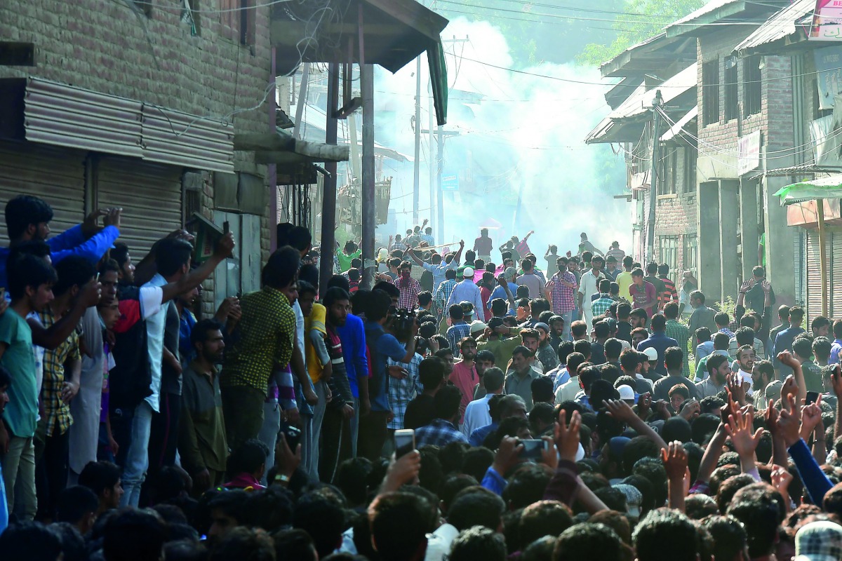 Kashmiri youths clashing with government forces during the funeral of Tanveer Ahmed in Beerwah, yesterday.