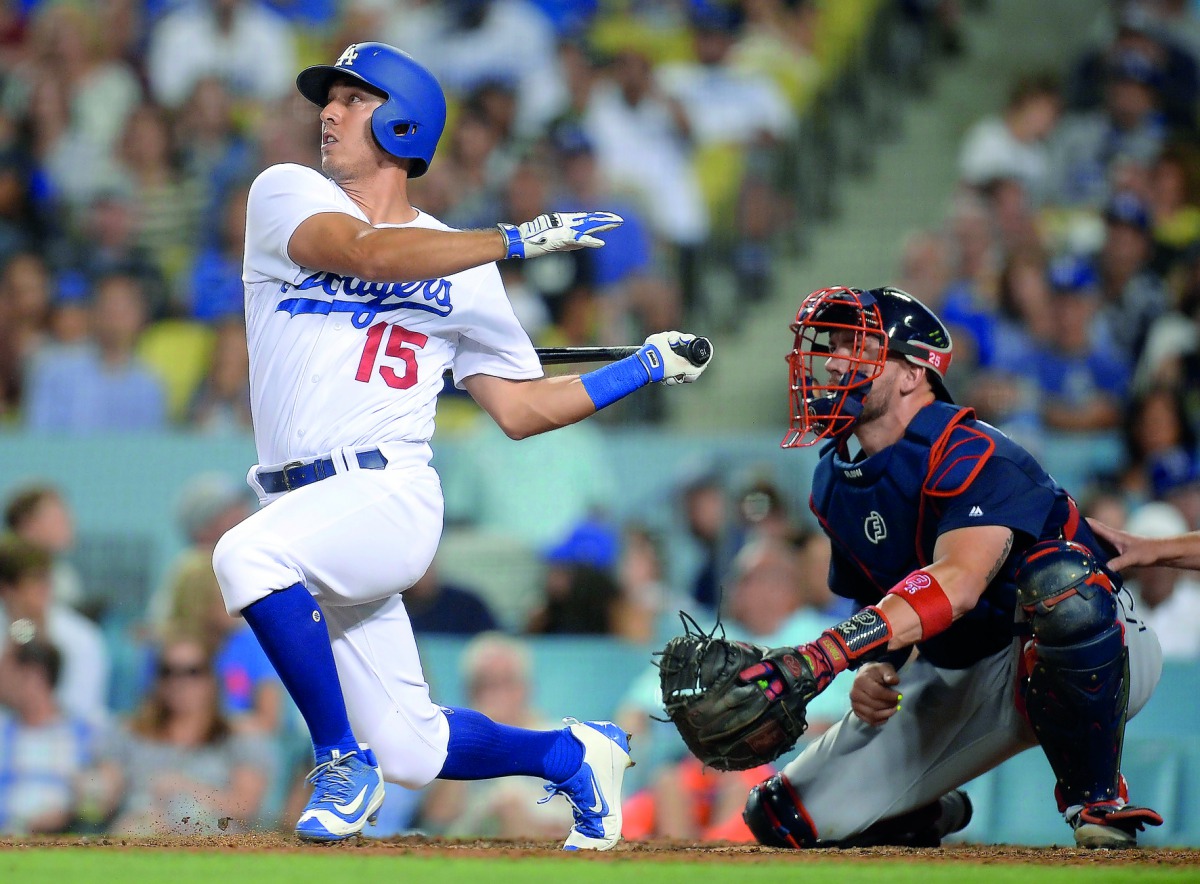 Los Angeles Dodgers’ Austin Barnes hits a single in the eighth inning against the Atlanta Braves at Dodger Stadium on Saturday. 