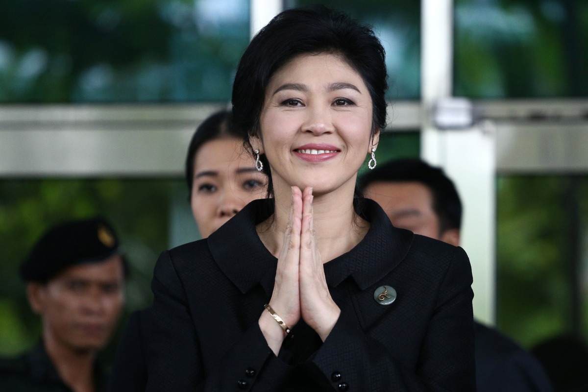 Ousted former Thai prime minister Yingluck Shinawatra gestures in a traditional greeting as she leaves the Supreme Court in Bangkok, Thailand, July 21, 2017. Reuters/Athit Perawongmetha