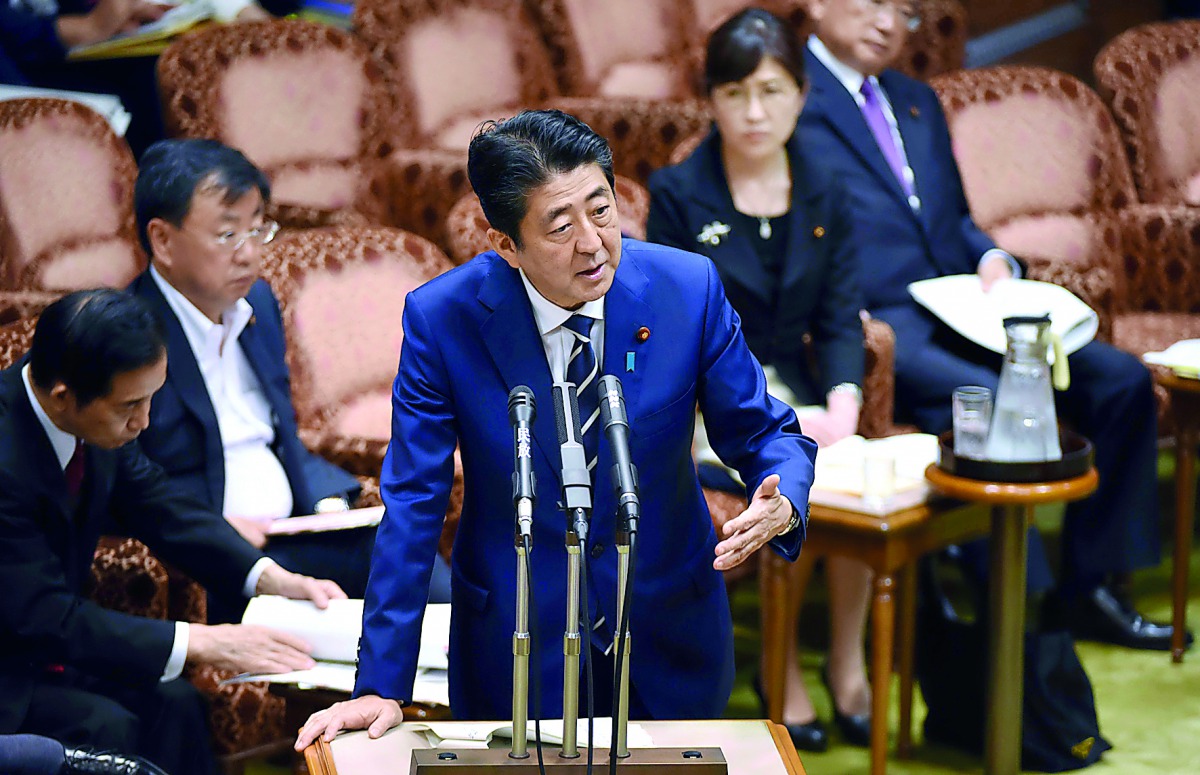 Japan’s Prime Minister Shinzo Abe answers questions during a budget committee meeting in the Upper House of parliament in Tokyo. For months Abe has been dogged by scandals.
